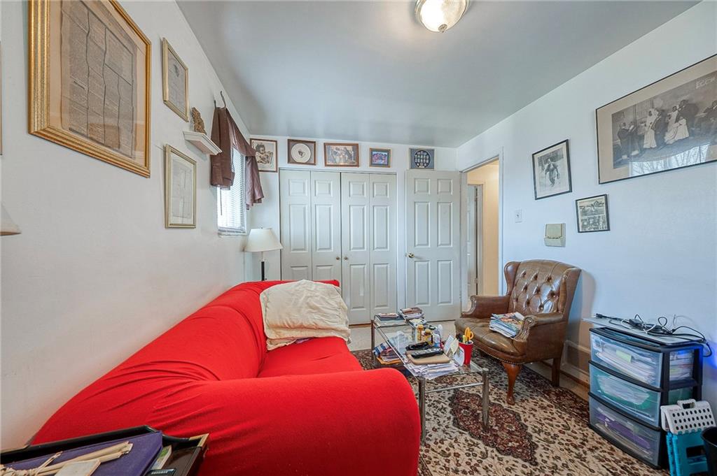 923 Locust Street Coraopolis, PA 15108 - Photo 16 of 27 a living room with furniture and a window