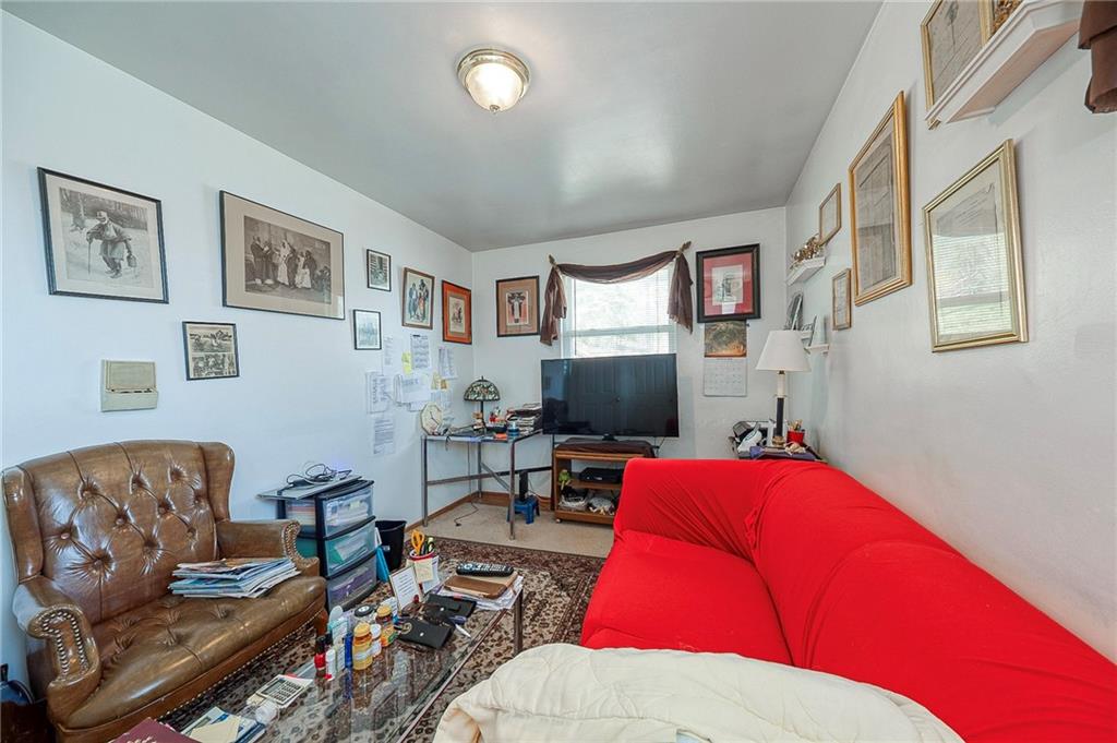 923 Locust Street Coraopolis, PA 15108 - Photo 17 of 27 a living room with furniture rug and a window