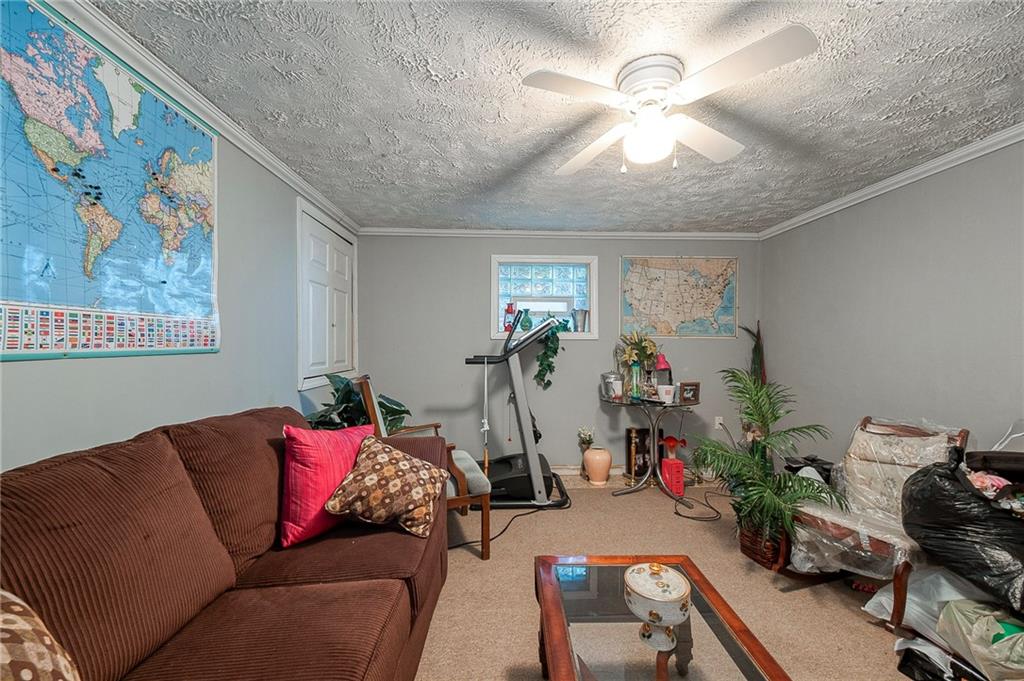 923 Locust Street Coraopolis, PA 15108 - Photo 19 of 27 a living room with furniture and flowers