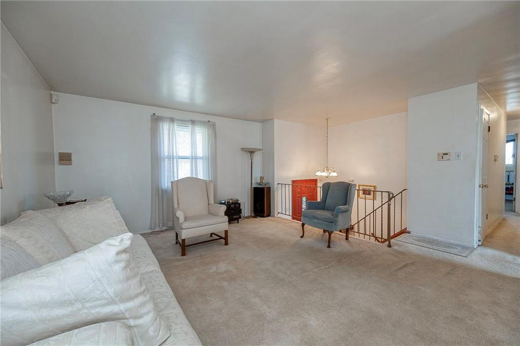 923 Locust Street Coraopolis, PA 15108 - Photo 4 of 27 a living room with furniture and a lamp