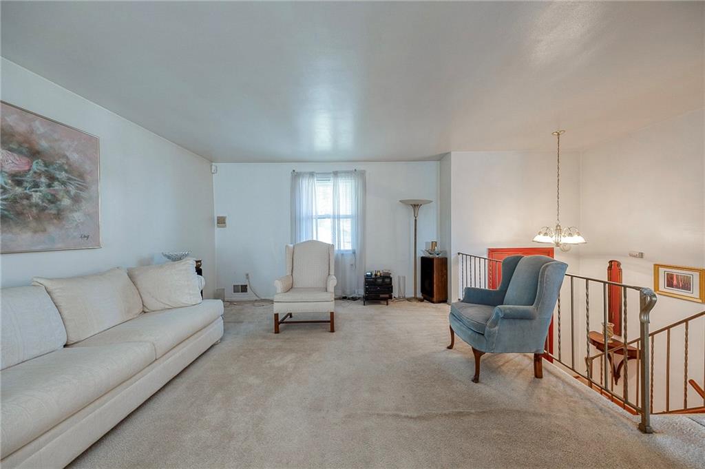 923 Locust Street Coraopolis, PA 15108 - Photo 6 of 27 a living room with furniture and a lamp