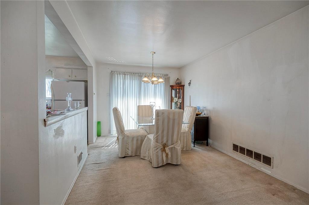 923 Locust Street Coraopolis, PA 15108 - Photo 8 of 27 a view of a kitchen and dining room