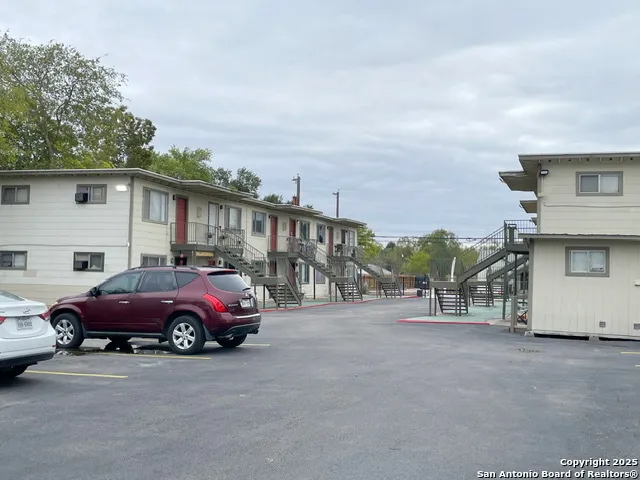 a front view of a house with parking space