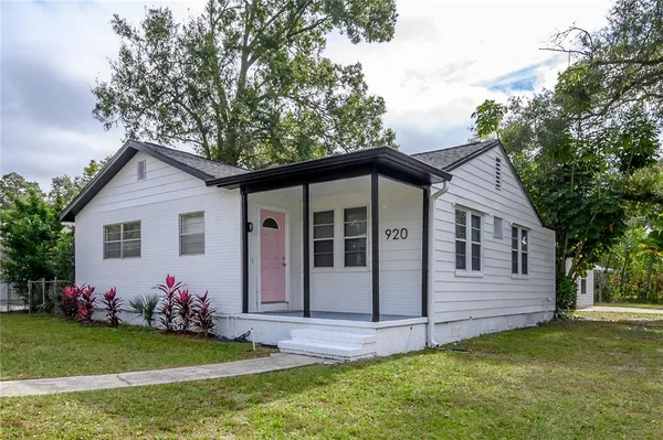 a view of a house with a yard