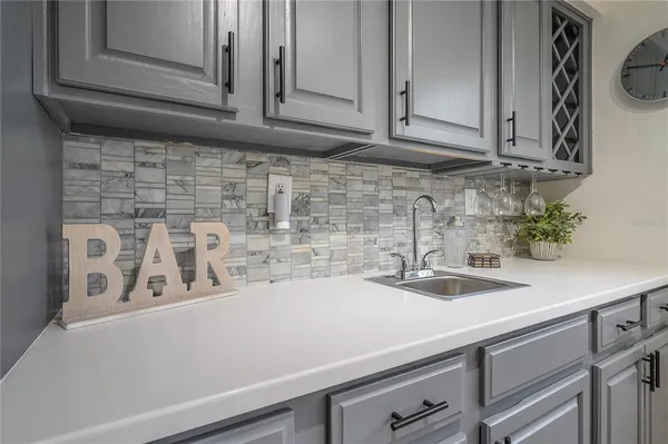 a kitchen with a sink and cabinets