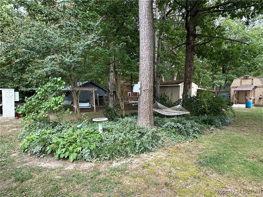 7809 Ark Road Gloucester, VA 23061 - Photo 31 of 32 View of yard featuring a shed