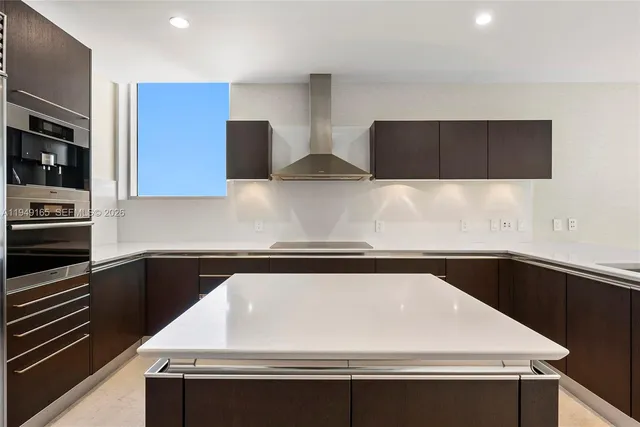 a utility room with stainless steel appliances