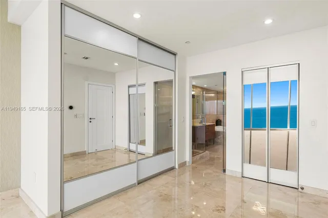 a bathroom with a shower and a glass door