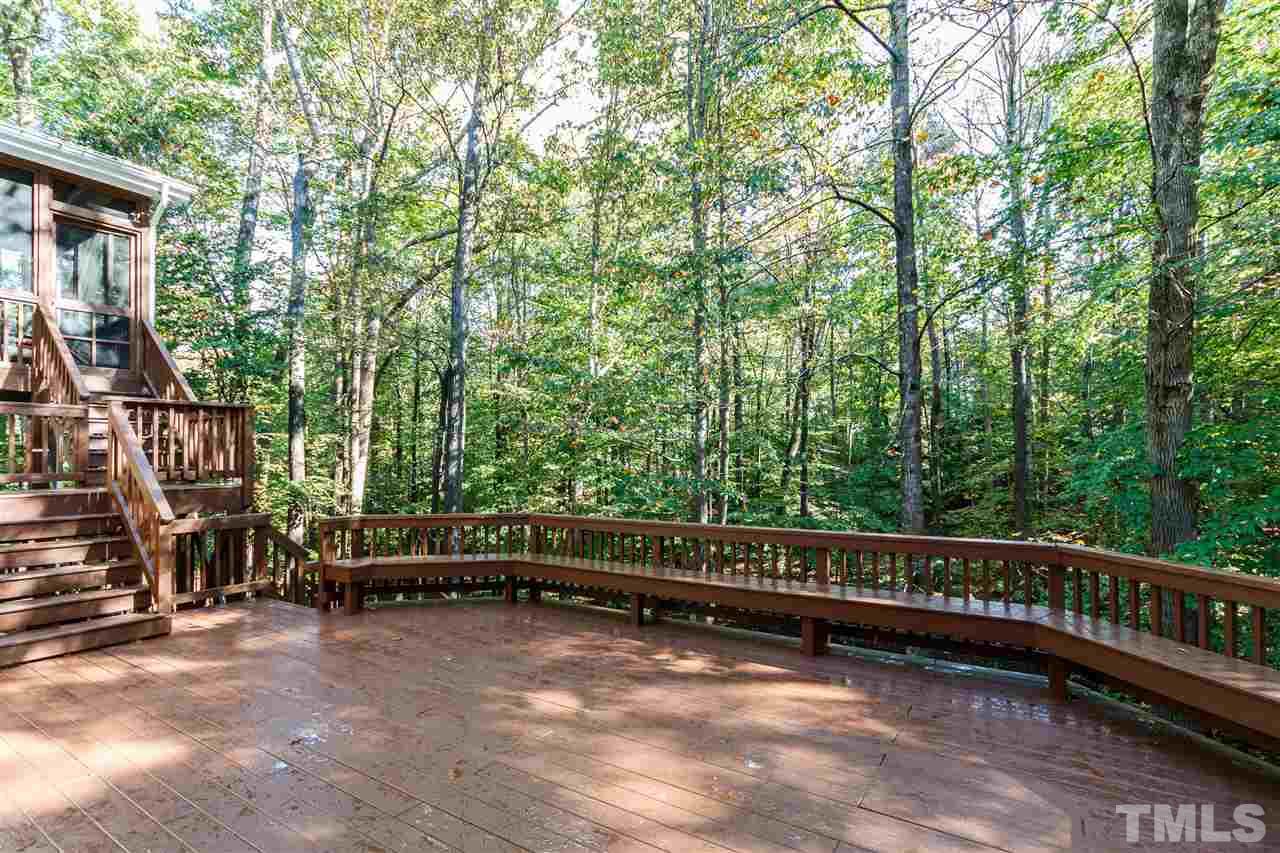 2936 Sunnystone Way Raleigh, NC 27613 - Photo 2 of 29 a view of outdoor space with deck and trees