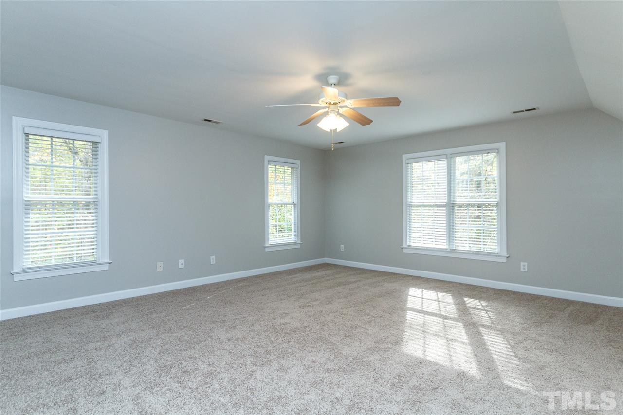 2936 Sunnystone Way Raleigh, NC 27613 - Photo 20 of 29 a view of an empty room with a window