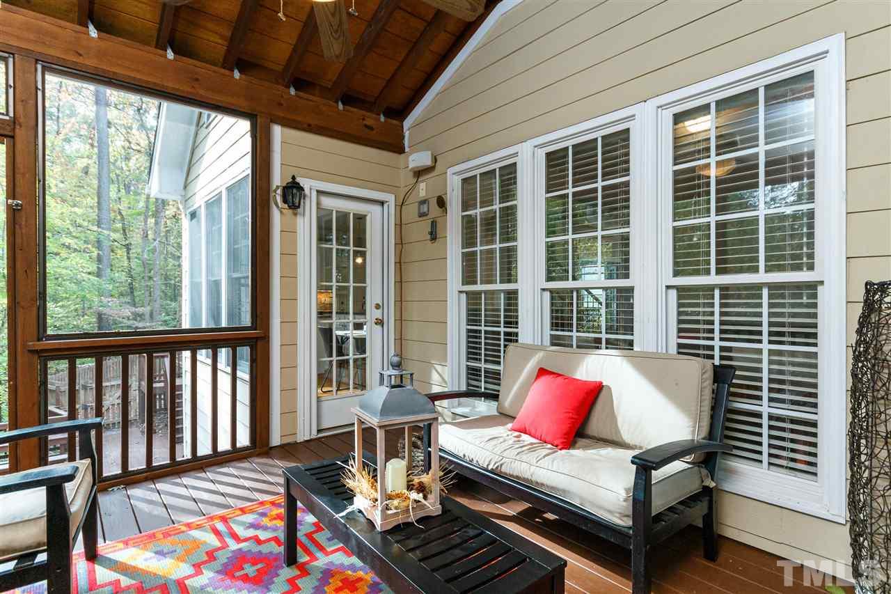 2936 Sunnystone Way Raleigh, NC 27613 - Photo 24 of 29 a view of a living room and wooden deck