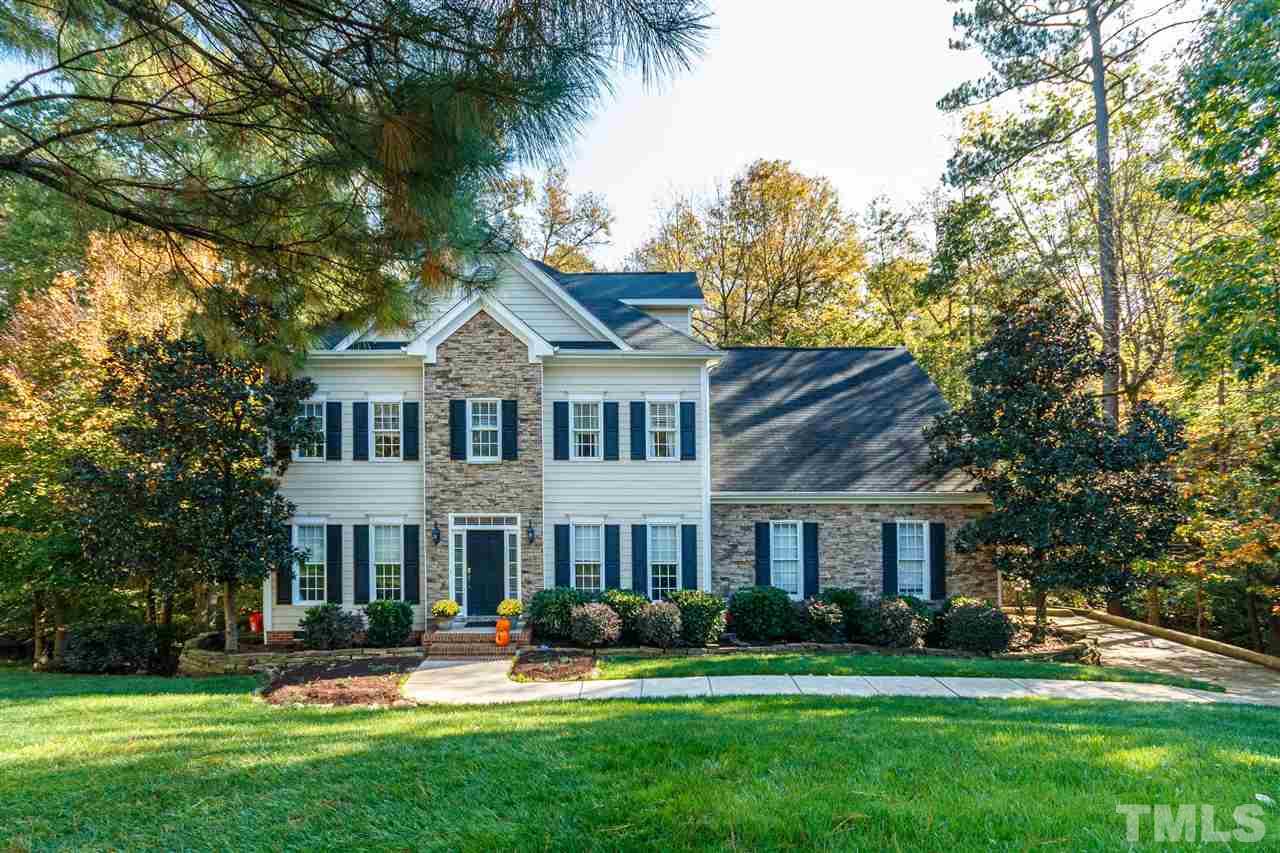 2936 Sunnystone Way Raleigh, NC 27613 - Photo 29 of 29 a front view of a house with garden and trees