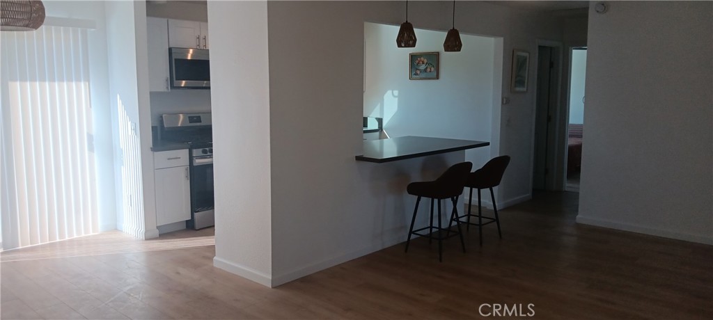 1022 Ruby Drive Perris, CA 92571 - Photo 14 of 27 a view of a livingroom with furniture and wooden floor