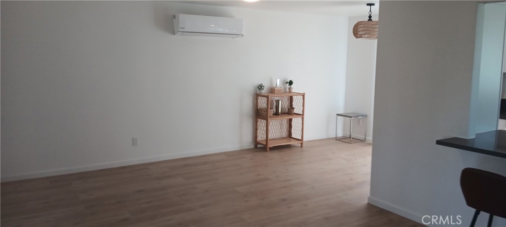 1022 Ruby Drive Perris, CA 92571 - Photo 15 of 27 an empty room with a book shelf