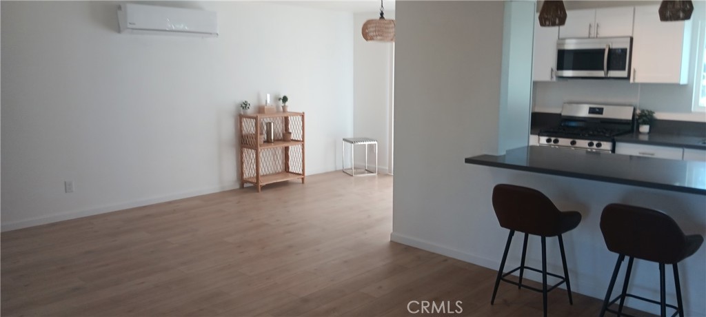 1022 Ruby Drive Perris, CA 92571 - Photo 17 of 27 a living room with furniture and a flat screen tv