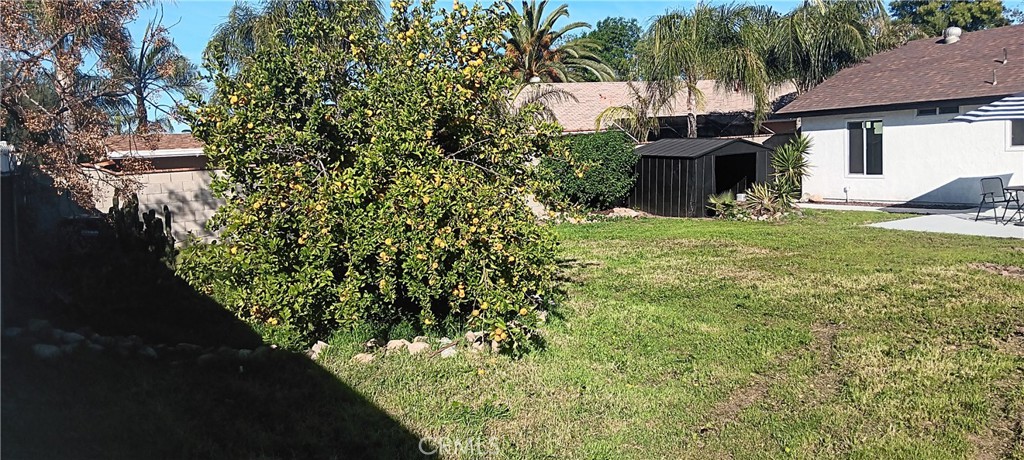 1022 Ruby Drive Perris, CA 92571 - Photo 21 of 27 a view of a backyard with table and chairs and potted plants