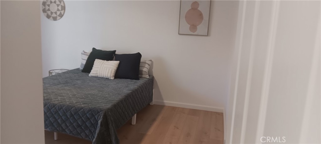 1022 Ruby Drive Perris, CA 92571 - Photo 25 of 27 a bedroom with a bed and a window