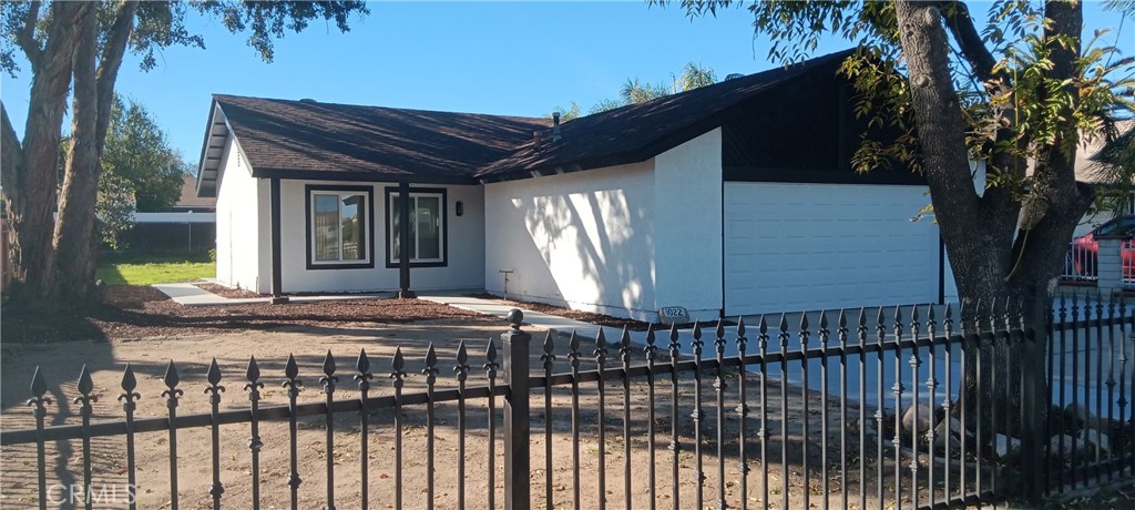 1022 Ruby Drive Perris, CA 92571 - Photo 7 of 27 a front view of house with a garden