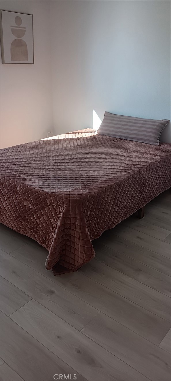 1022 Ruby Drive Perris, CA 92571 - Photo 10 of 27 a living room with a couch wooden floor and a table