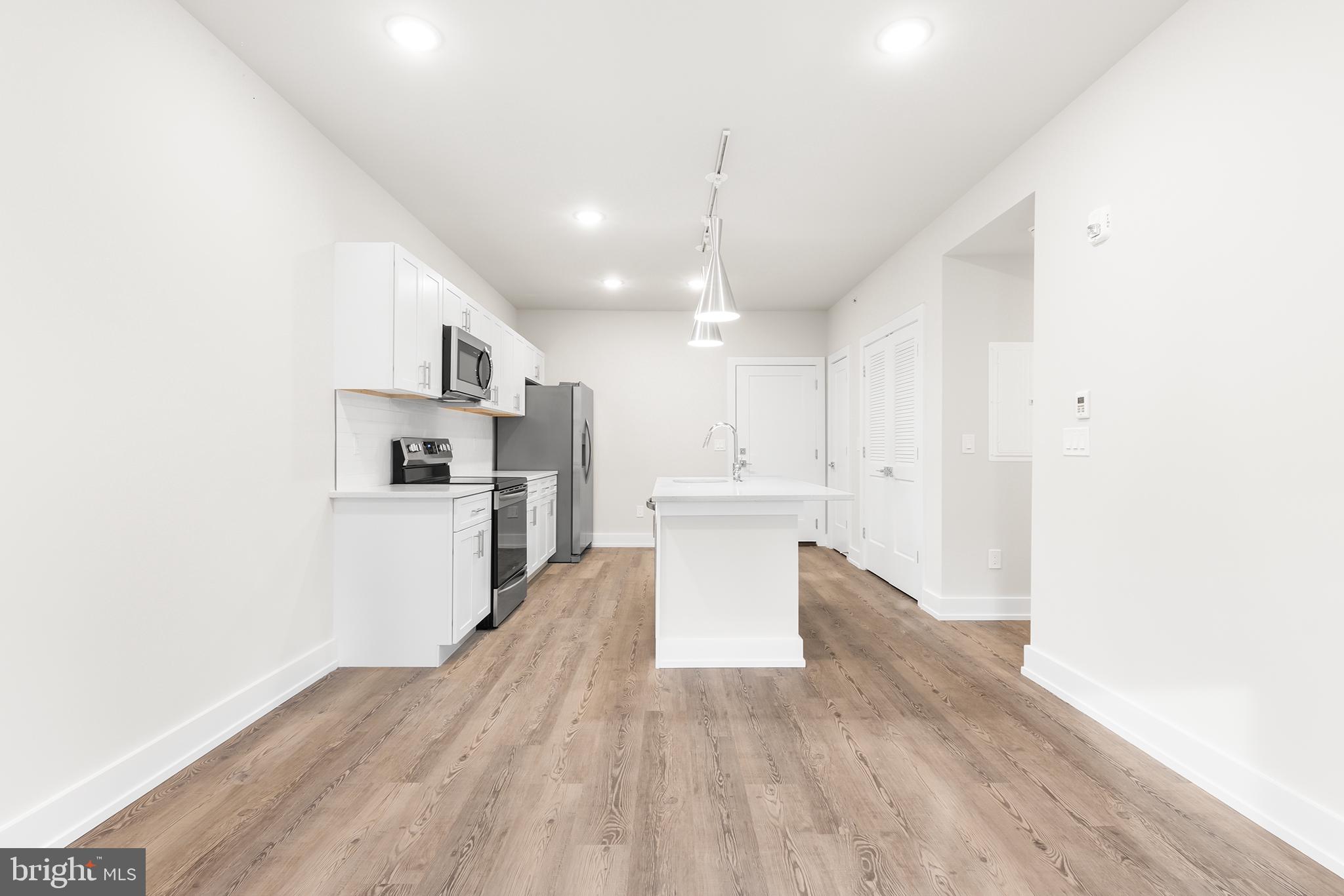 214 Vine Street, Unit 104 Philadelphia, PA 19106 - Photo 24 of 35 a view of kitchen with wooden floor