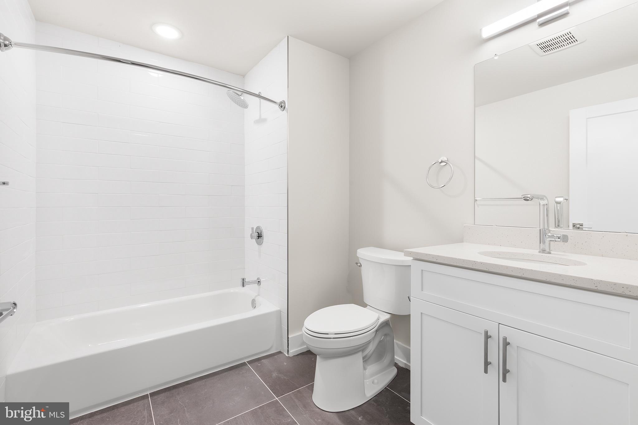 214 Vine Street, Unit 104 Philadelphia, PA 19106 - Photo 26 of 35 a bathroom with a sink toilet and shower