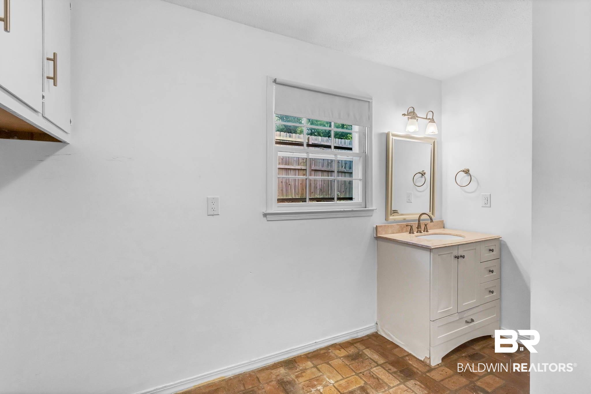 309 West Brandy Run Road Mobile, AL 36608 - Photo 61 of 100 Bathroom with brick flooring and vanity