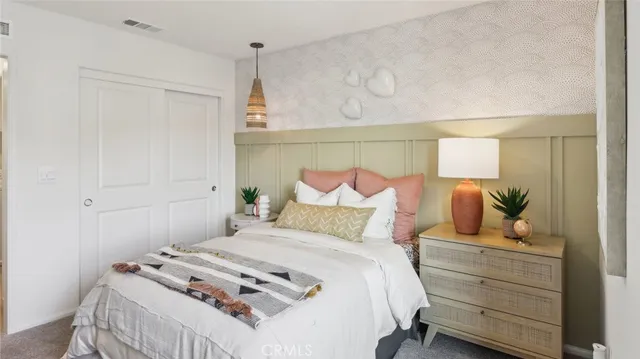 a bedroom with a bed and a table in it