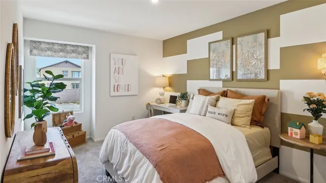 a bedroom with bed and a window