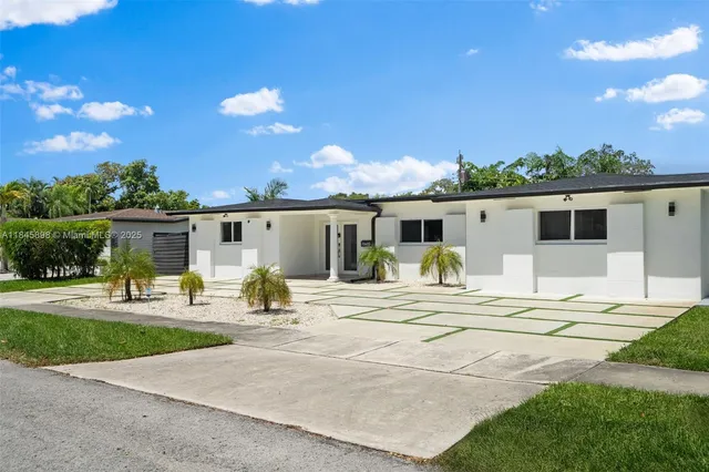 a view of a patio with a backyard