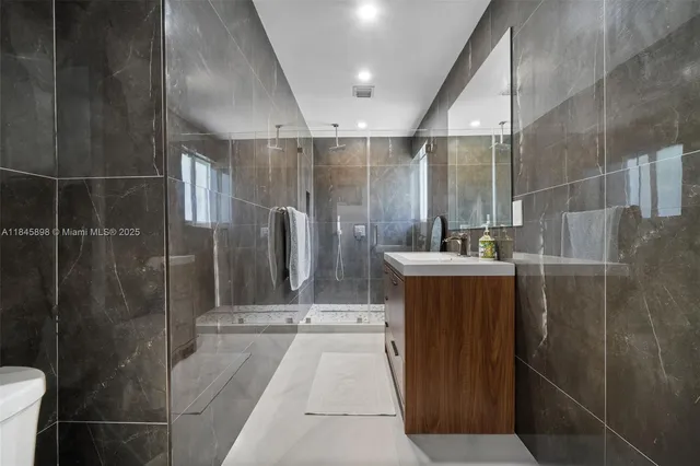 a bathroom with a sink and mirror