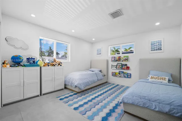 a bedroom with a bed and cabinets