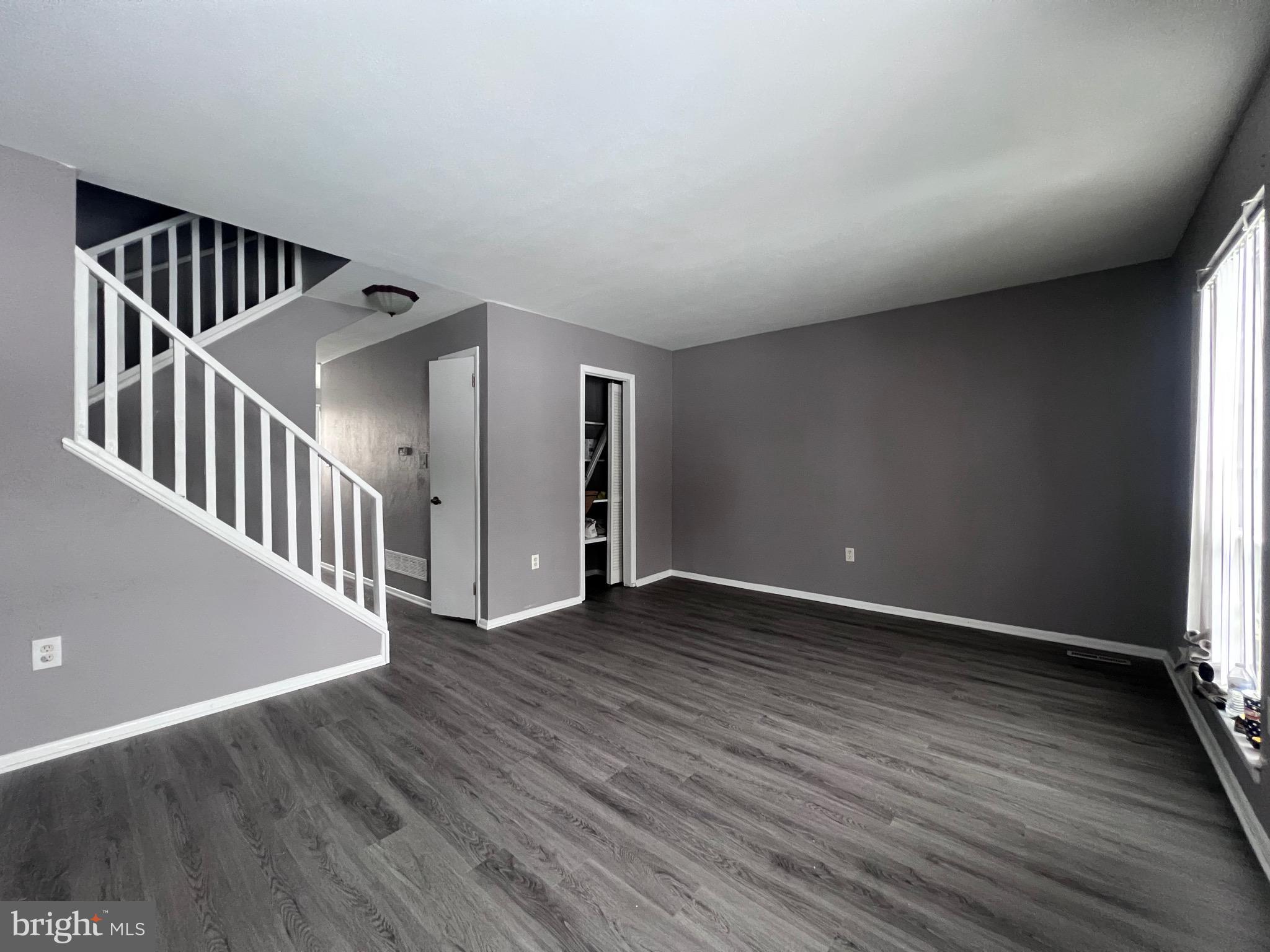 120 Hopkins Court Newark, DE 19713 - Photo 2 of 10 wooden floor in a hall with a window