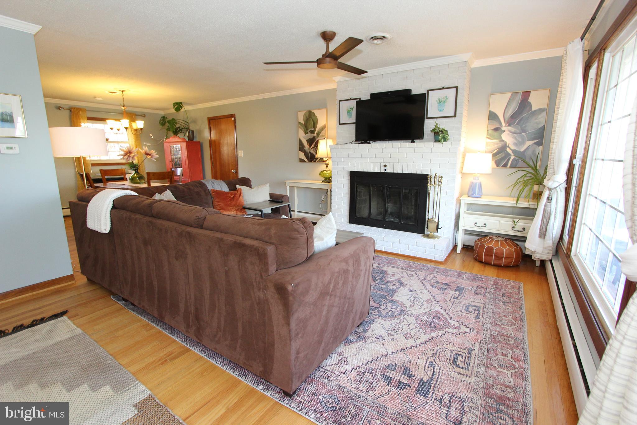5605 Shookstown Road Frederick, MD 21702 - Photo 13 of 53 Amazing living room with brick hearth fireplace