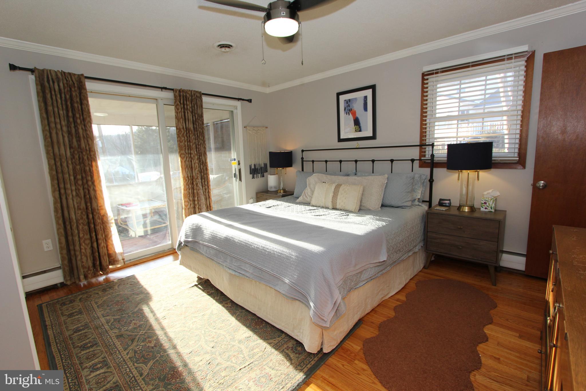 5605 Shookstown Road Frederick, MD 21702 - Photo 15 of 53 Primary bedroom view towards screened porch