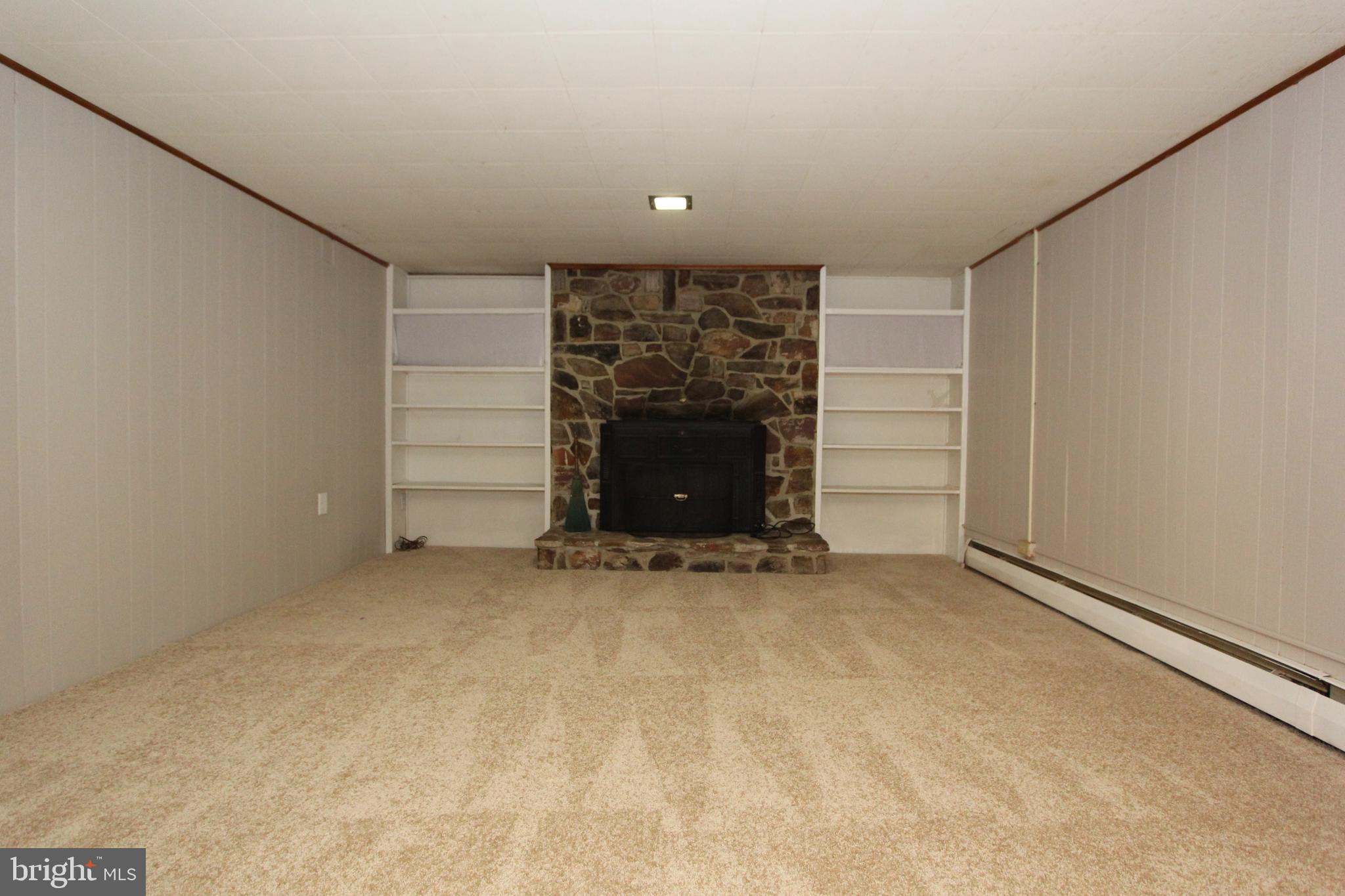 5605 Shookstown Road Frederick, MD 21702 - Photo 24 of 53 Finished lower level with fireplace & built-ins