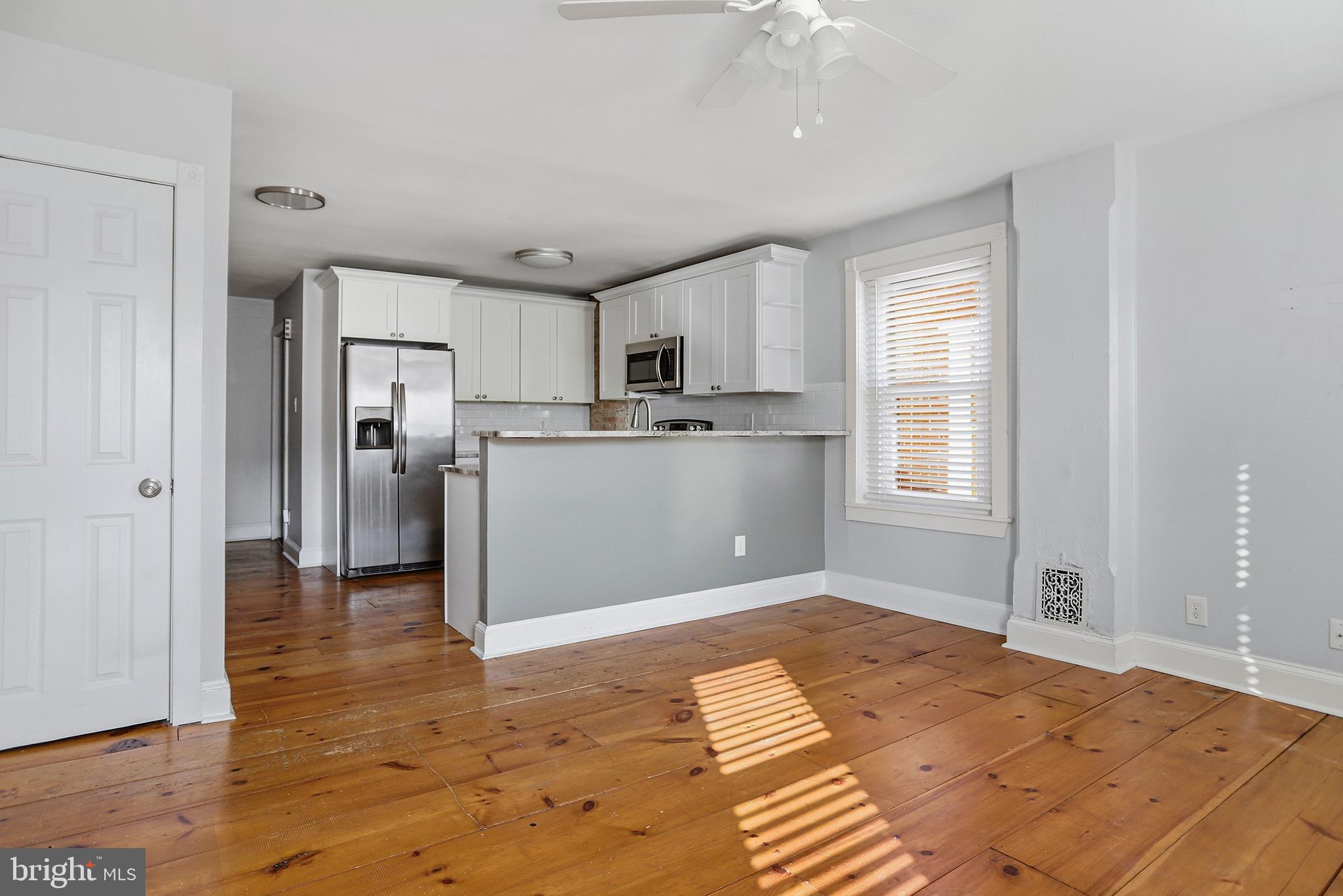 33 East Front Street Media, PA 19063 - Photo 3 of 11 a kitchen with stainless steel appliances granite countertop a refrigerator and a sink