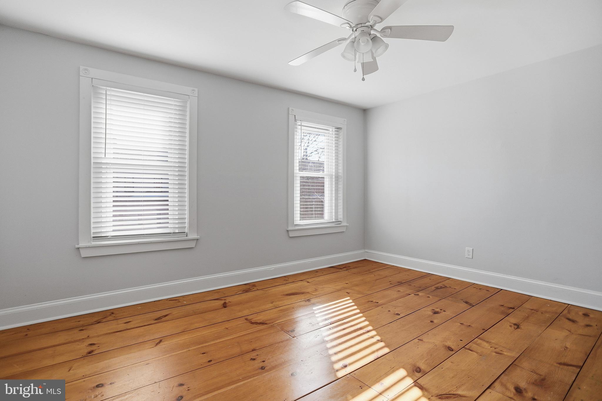 33 East Front Street Media, PA 19063 - Photo 4 of 11 a view of an empty room with wooden floor and a window