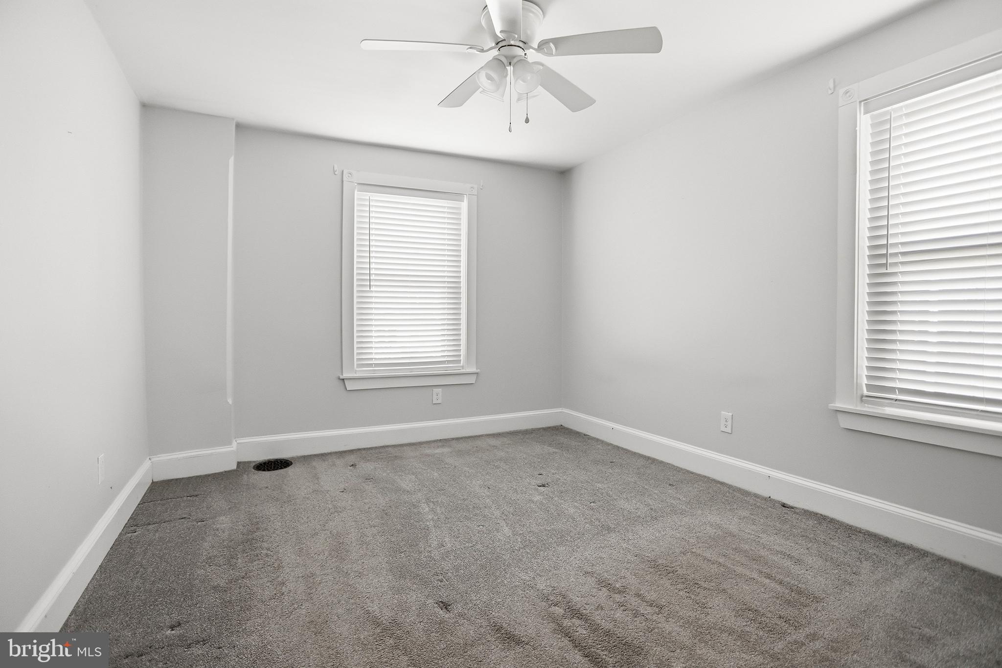 33 East Front Street Media, PA 19063 - Photo 9 of 11 an empty room with chandelier fan and windows
