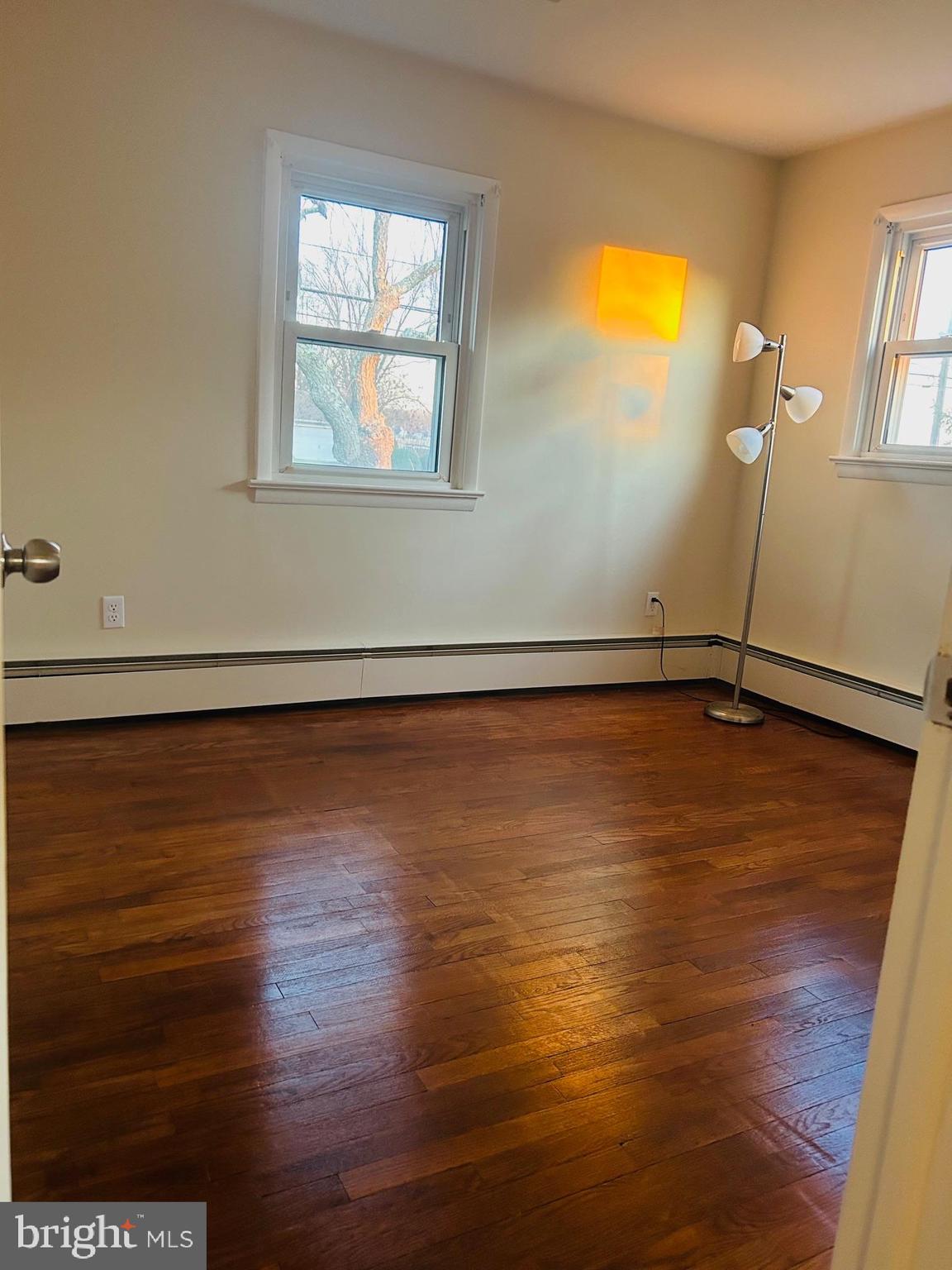 45 Cubberley Road West Windsor, NJ 08550 - Photo 19 of 37 a view of an empty room with wooden floor and a window