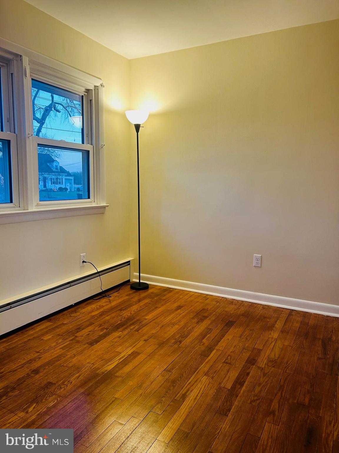45 Cubberley Road West Windsor, NJ 08550 - Photo 20 of 37 a view of an empty room with wooden floor and a window