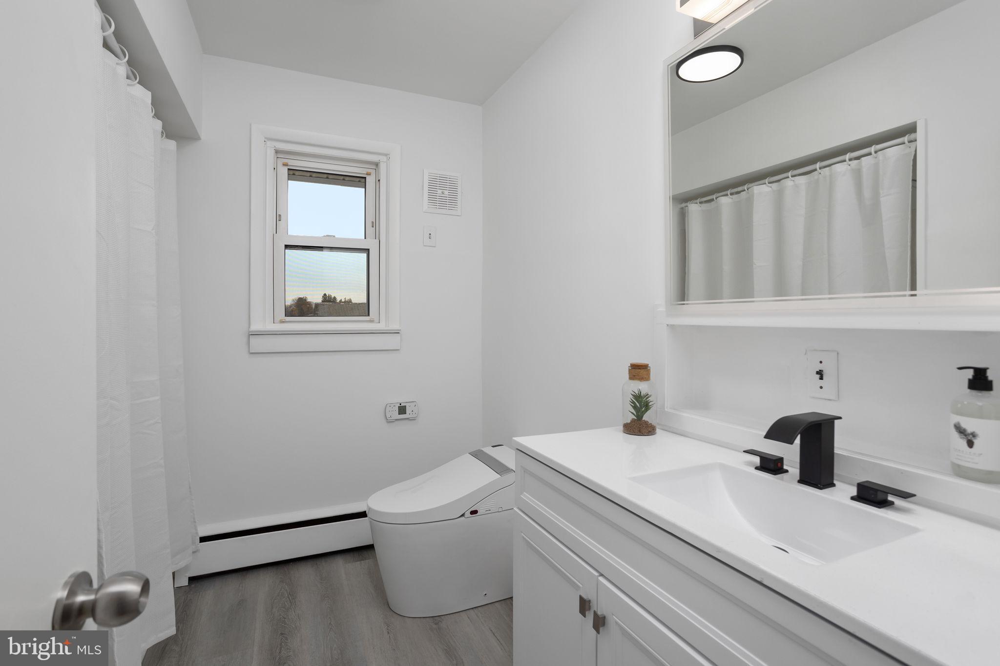 45 Cubberley Road West Windsor, NJ 08550 - Photo 23 of 37 a bathroom with a sink toilet and vanity