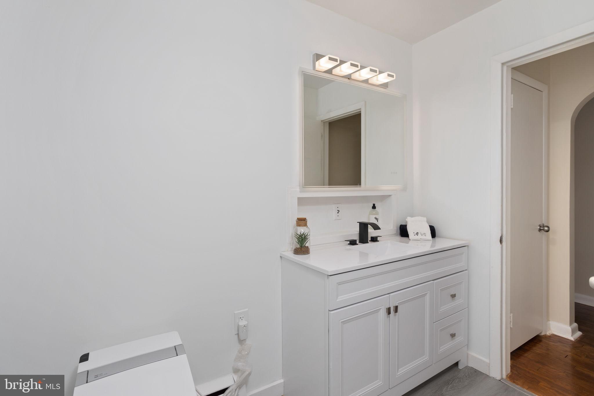 45 Cubberley Road West Windsor, NJ 08550 - Photo 24 of 37 a bathroom with a sink toilet and mirror