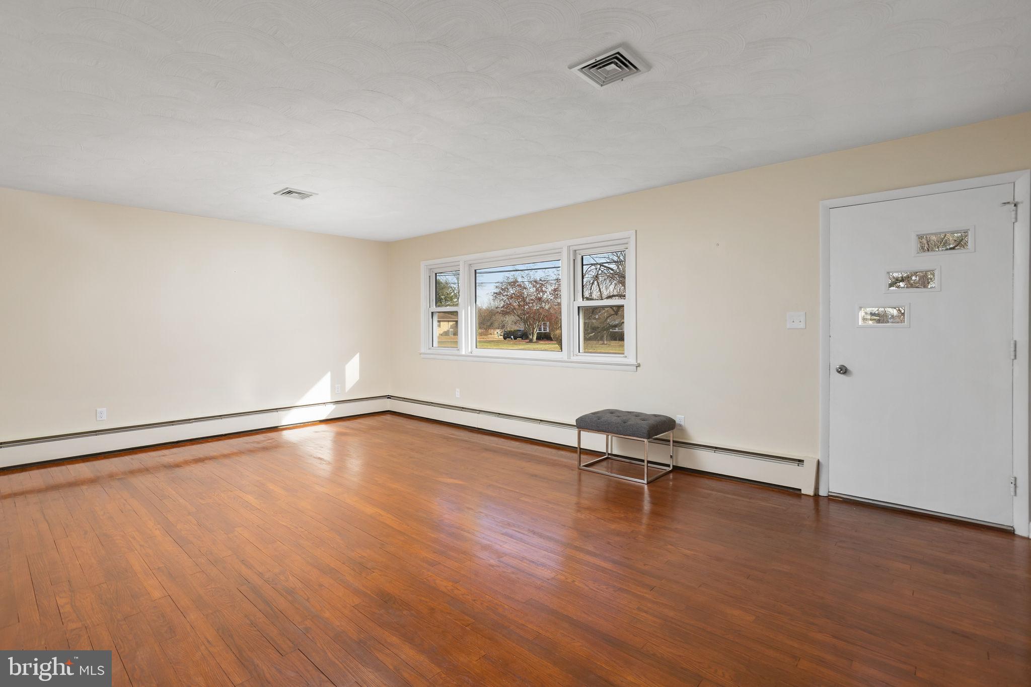45 Cubberley Road West Windsor, NJ 08550 - Photo 5 of 37 a view of a room with wooden floor and a window
