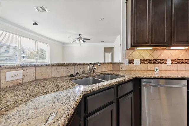 a kitchen with a sink and cabinets