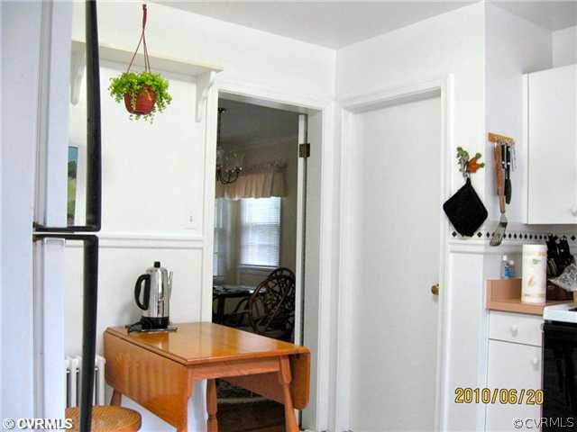 4406 Butte Road Richmond, VA 23235 - Photo 5 of 12 a kitchen with a refrigerator and a stove