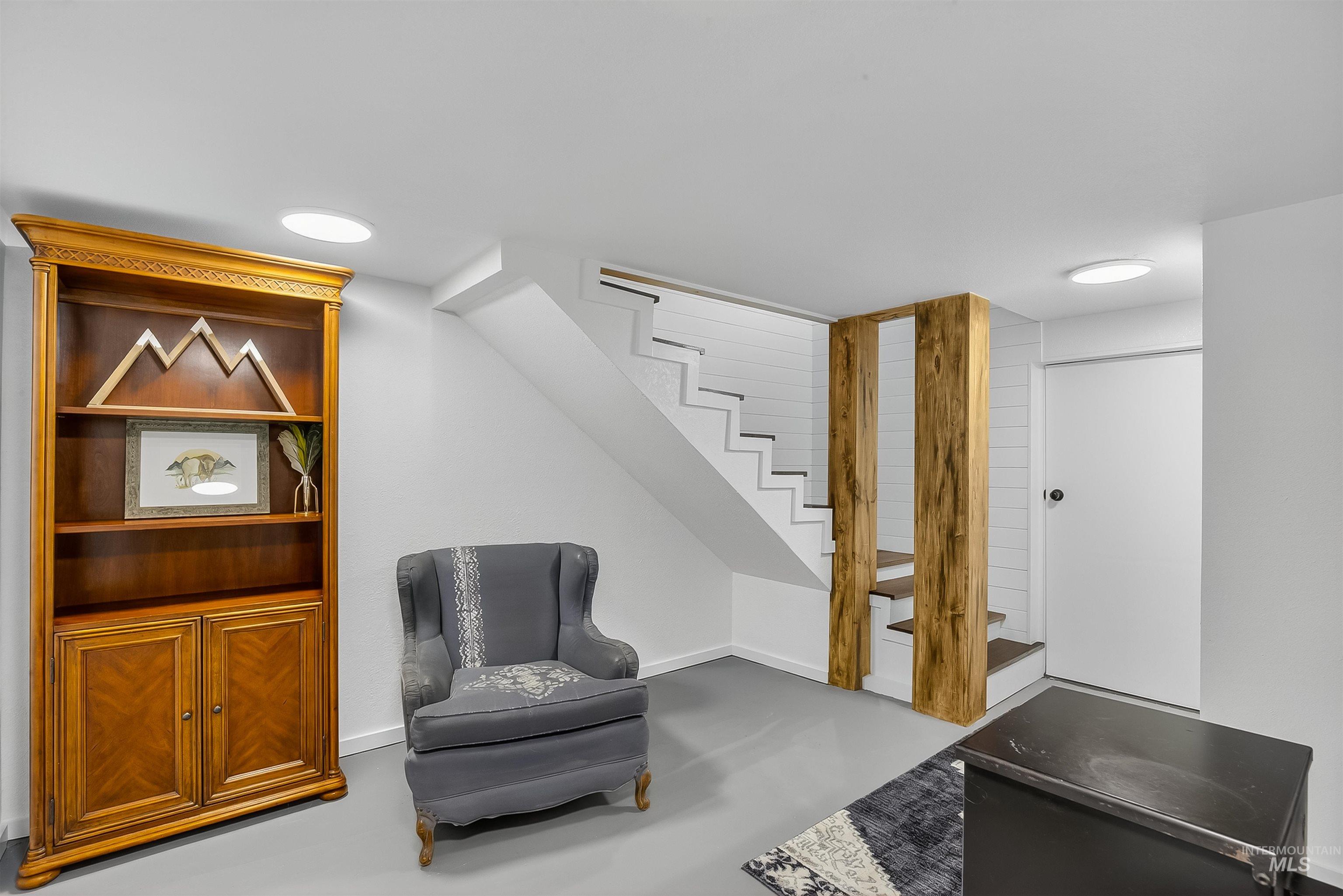 2157 Lukes Gulch Road Stites, ID 83552 - Photo 34 of 50 Sitting room featuring stairway and finished concrete flooring