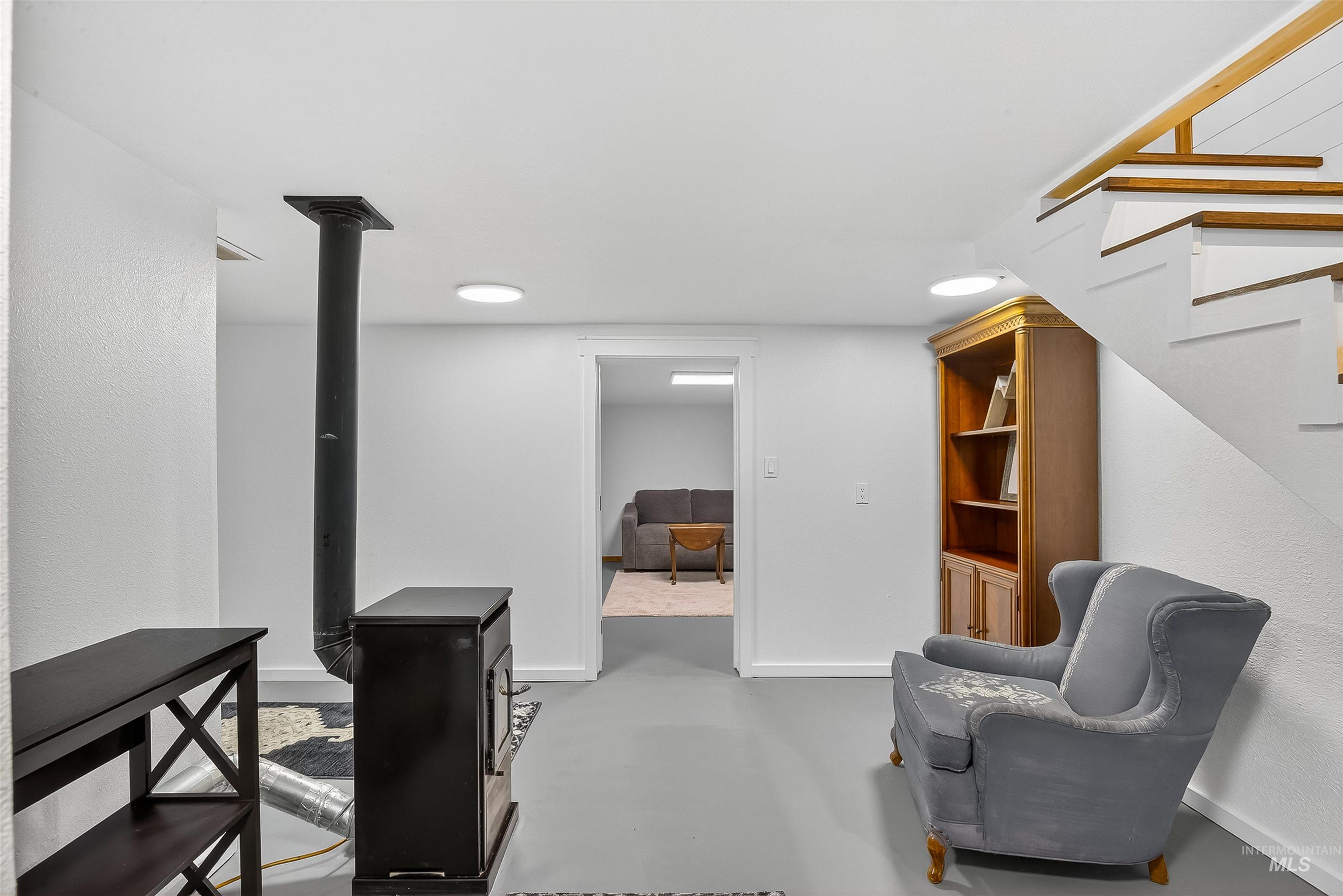 2157 Lukes Gulch Road Stites, ID 83552 - Photo 36 of 50 Sitting room featuring concrete floors and stairs