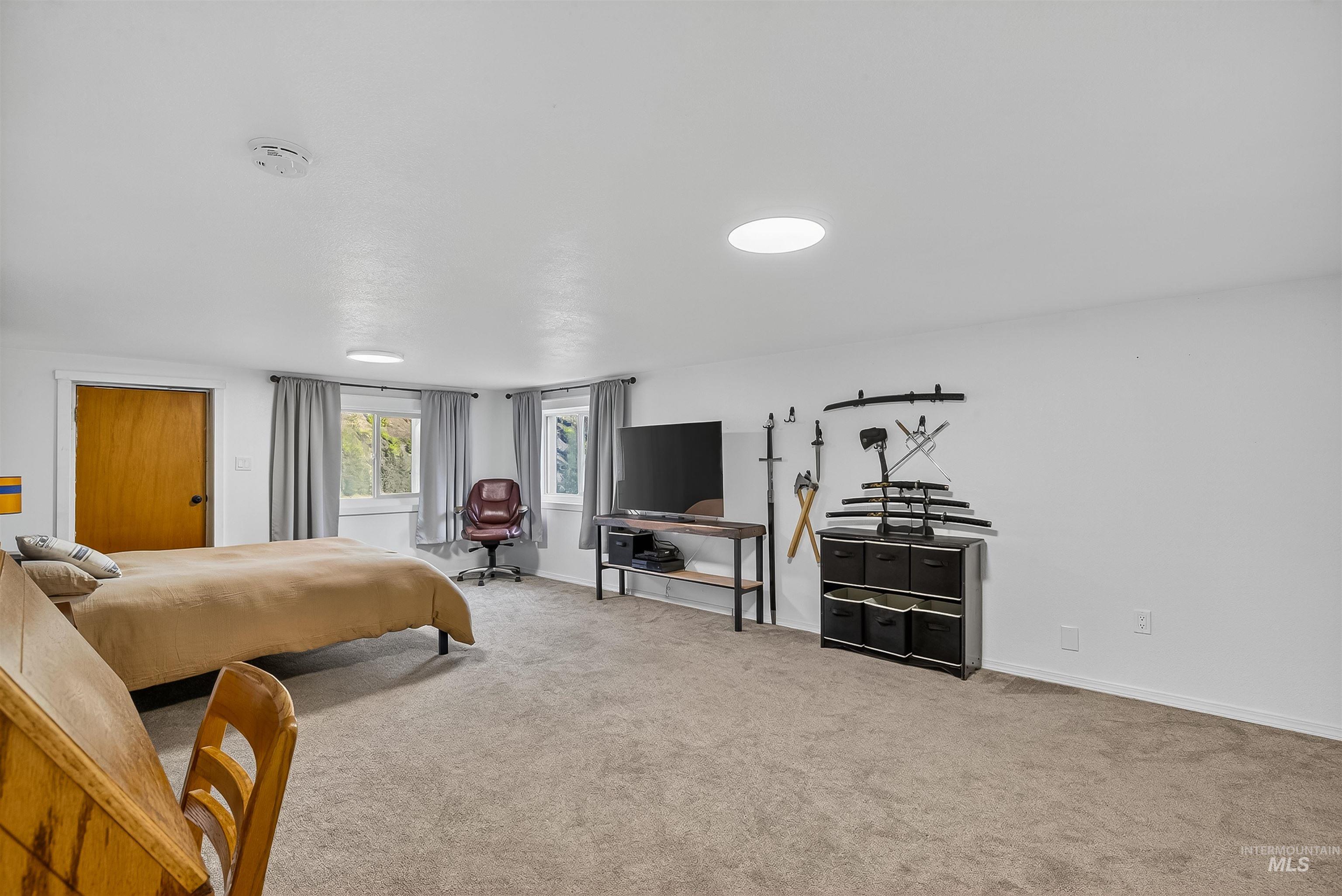 2157 Lukes Gulch Road Stites, ID 83552 - Photo 41 of 50 Bedroom with light colored carpet and baseboards