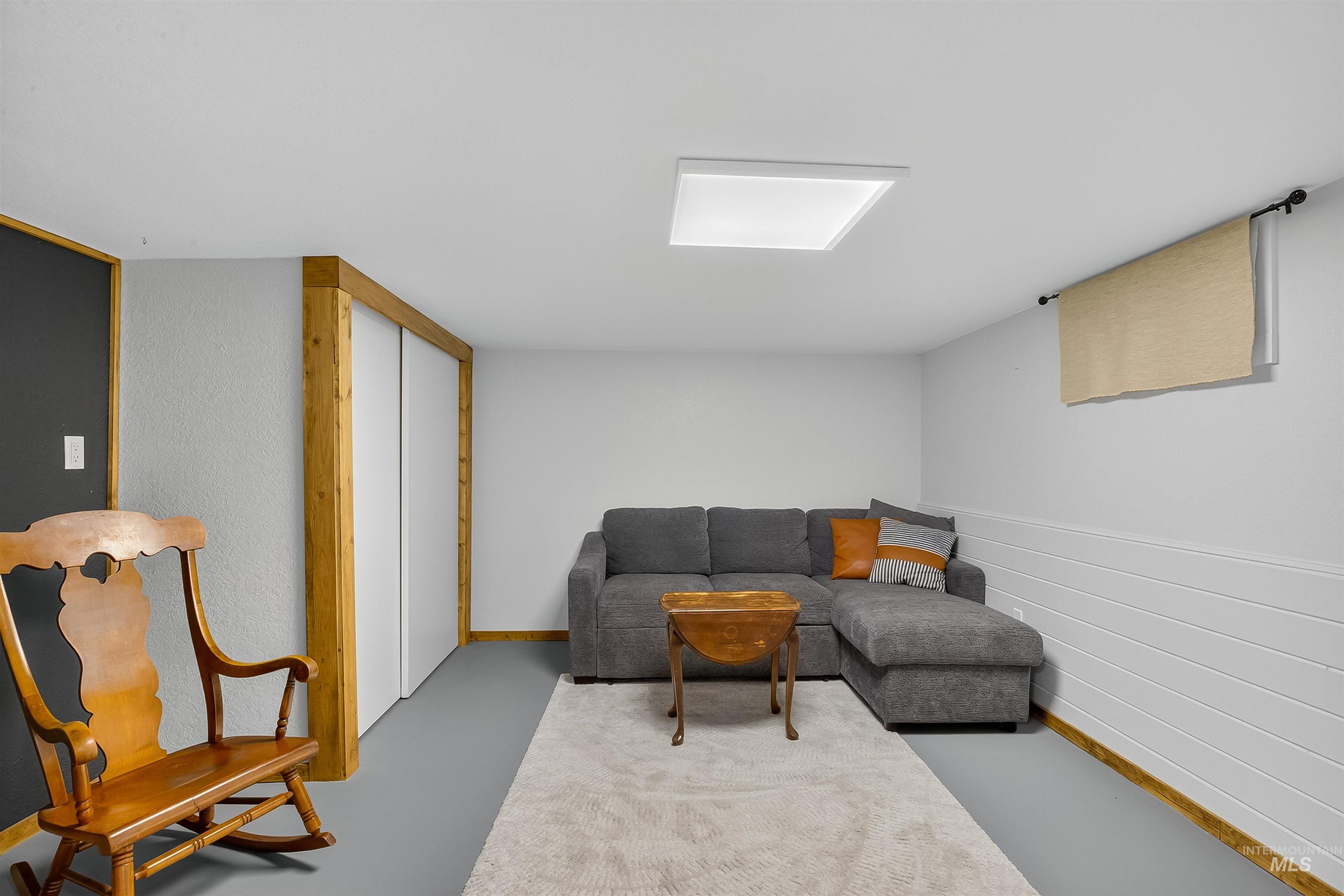 2157 Lukes Gulch Road Stites, ID 83552 - Photo 42 of 50 Living room featuring concrete floors and baseboards