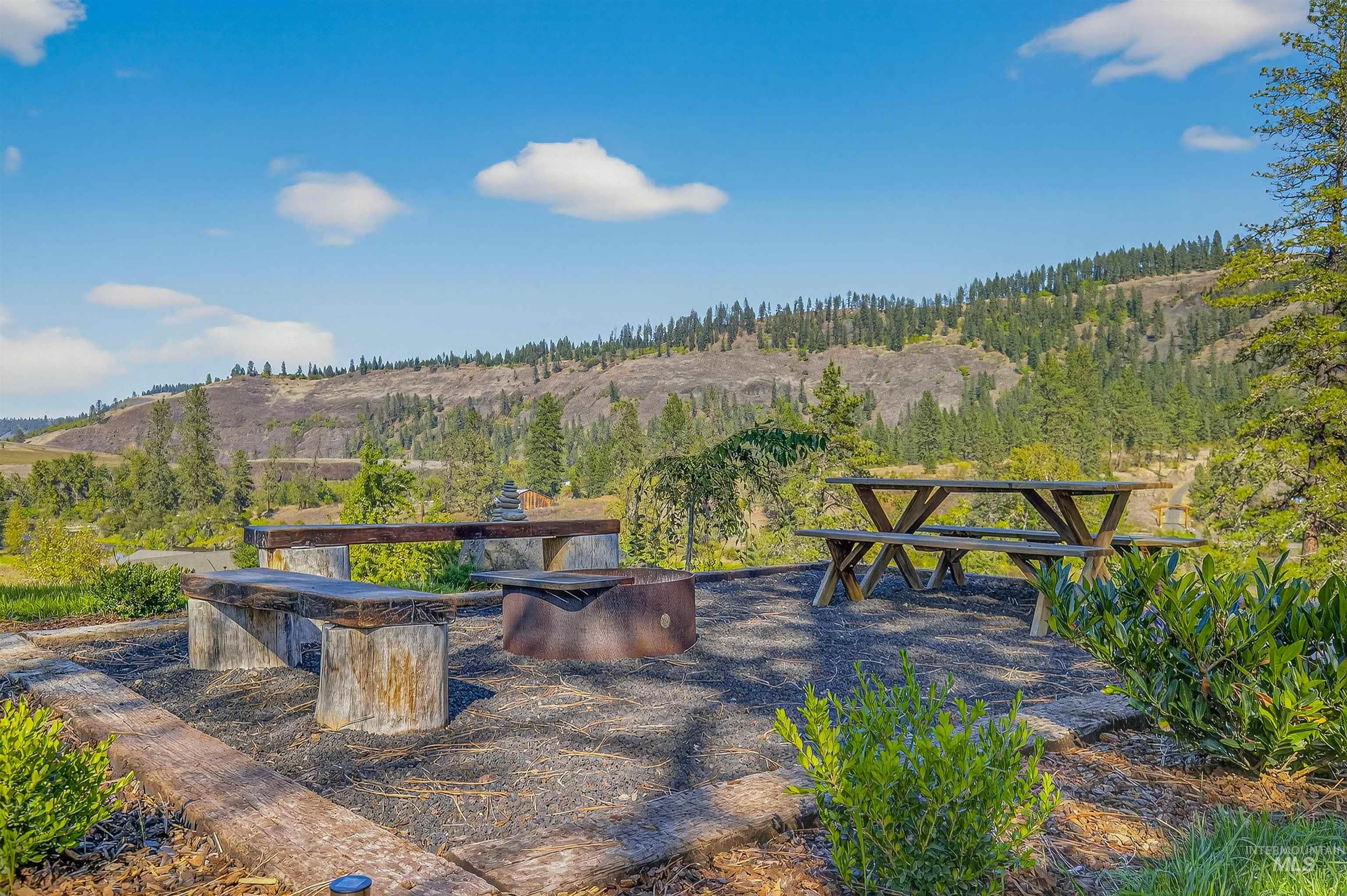 2157 Lukes Gulch Road Stites, ID 83552 - Photo 8 of 50 View of patio / terrace featuring a view of trees